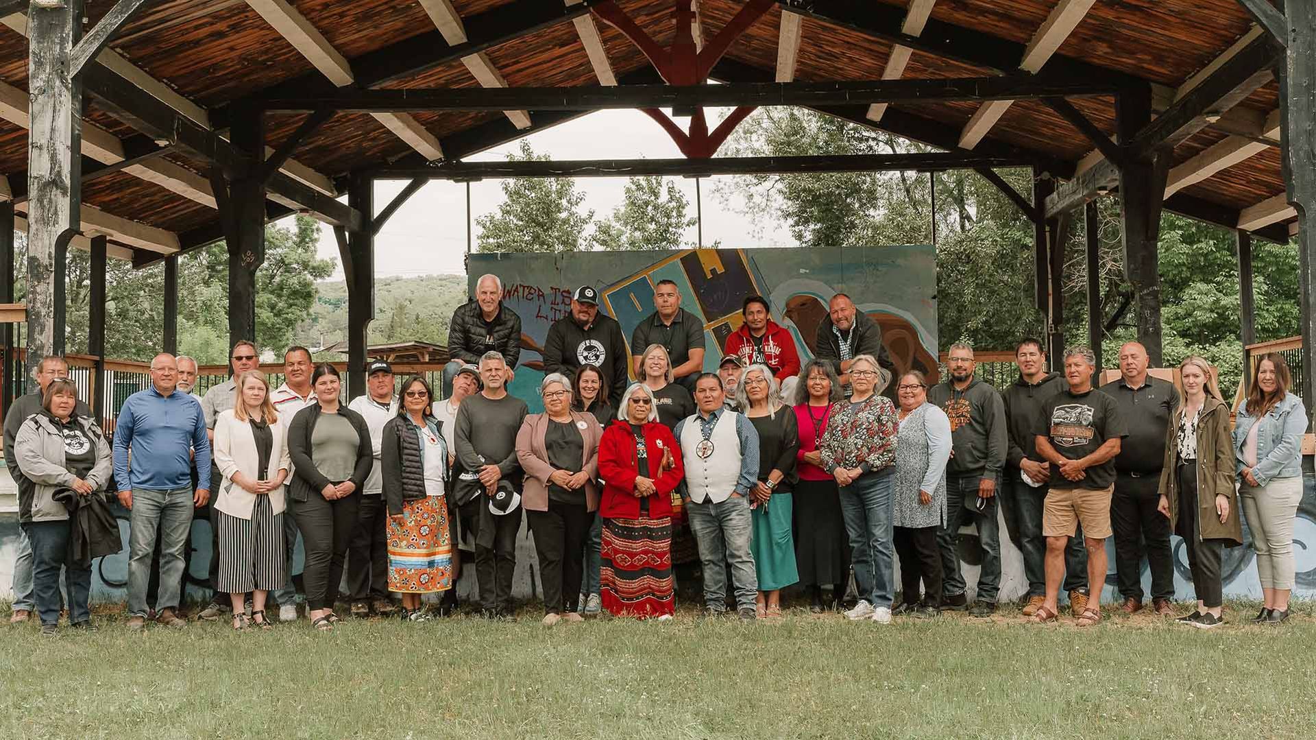 A group of people in a Canadian Indigenous community posing for a group photo.