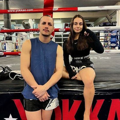 Photo of athletic woman and man at a gym.