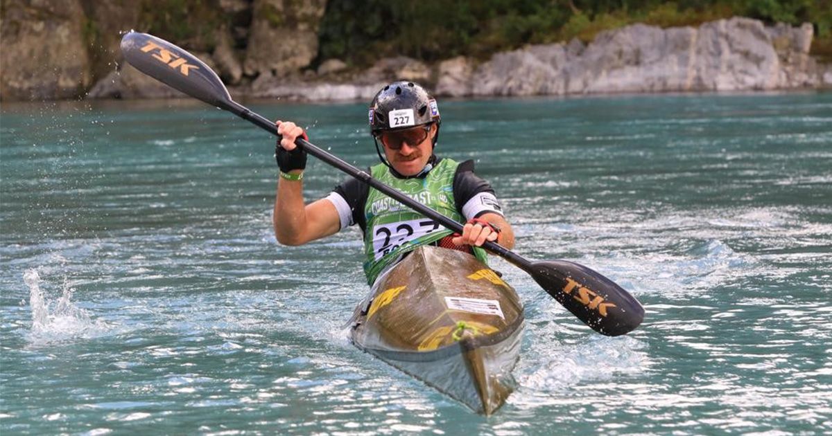 Mo Bro BOC in a kayak paddling down a river.