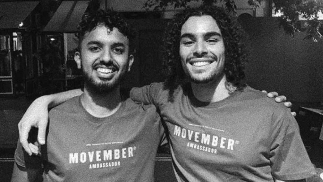2 Movember ambassadors with arms around eachother