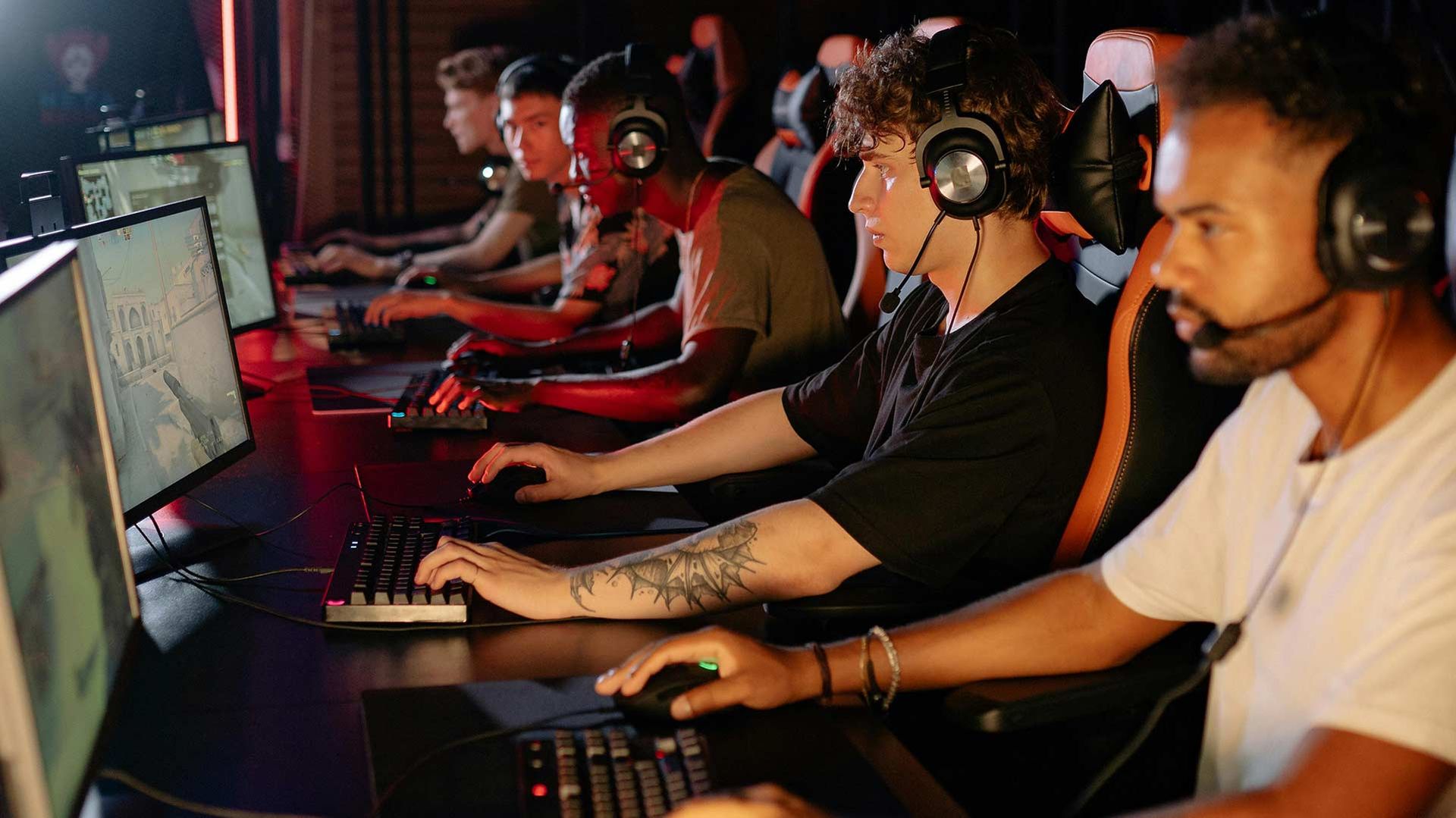 Photo of young men playing an esports tournament.
