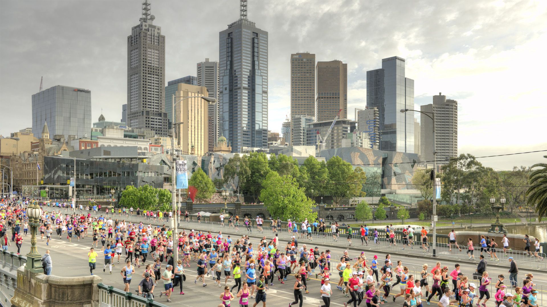Melbourne skyline with runners