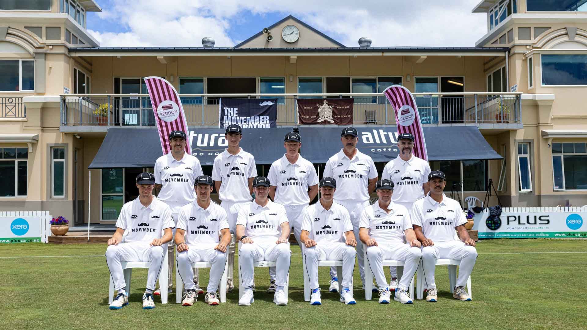 Group of cricket players in three lines pose for team photo in front of cricket club rooms